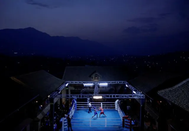 Women boxers fight on a ring during an all-women boxing event organised by Boxmandu Boxing Club on the occasion of International Women’s Day in Kathmandu, Nepal on March 8, 2021. (Photo by Navesh Chitrakar/Reuters)