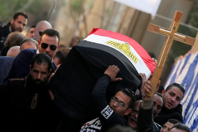 Relatives of Nabiel Habieb, a Christian man who was killed in the bombing of Cairo's main Coptic cathedral, carry his body to bury him at the Mokattam Cemetery in Cairo, Egypt December 12, 2016. (Photo by Amr Abdallah Dalsh/Reuters)