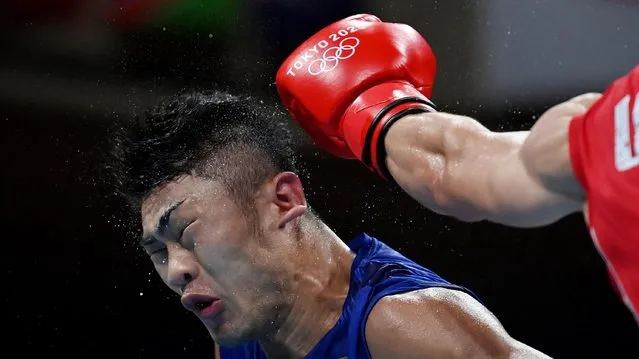 Yuito Moriwaki from Japan and Oleksandr Khyzhniak from Ukraine during pre final boxing knock out rounds at Kokugikan arena at the Tokyo Olympics, Tokyo, Japan on July 28, 2021. (Photo by Luis Robayo/Pool via Reuters)