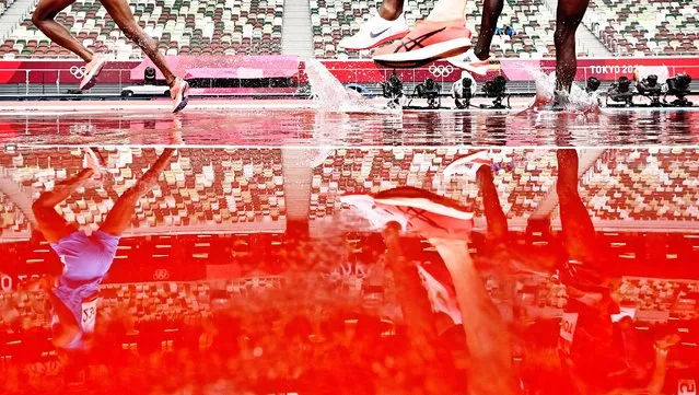 Runners compete in the men's 3000m Steeplechase Heats during the Athletics events of the Tokyo 2020 Olympic Games at the Olympic Stadium i​n Tokyo, Japan, 30 July 2021. (Photo by Christian Bruna/EPA/EFE)