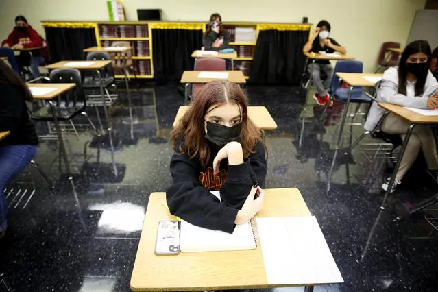 Students wearing protective masks attend classes on the first day of school in Miami-Dade County at Barbara Goleman Senior High School, in Miami, Florida, August 23, 2021. (Photo by Marco Bello/Reuters)