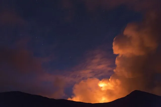 Smoke billows from the Plosky Tolbachik volcano. (Photo by Denis Budkov/Caters News)