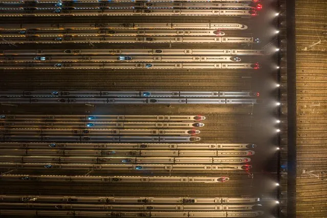 This aerial photo shows bullet trains parked at Nanjing south railway station in Nanjing, in eastern China's Jiangsu province on January 9, 2024. (Photo by AFP Photo/China Stringer Network)