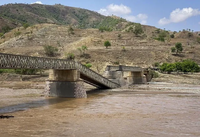 A destroyed bridge over the Tekeze River is seen in the Tigray region of northern Ethiopia Thursday, July 1, 2021. The bridge on a main supply route linking western Tigray that is crucial to delivering desperately needed food to much of Ethiopia's embattled Tigray region has been destroyed, aid groups said Thursday. (Photo by Roger Sandberg/Medical Teams International via AP Photo)