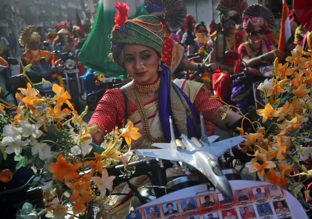 Women dressed in traditional costumes ride motorbikes as they attend celebrations to mark the Gudi Padwa festival, the beginning of the New Year for Maharashtrians, in Mumbai, April 6, 2019. (Photo by Francis Mascarenhas/Reuters)