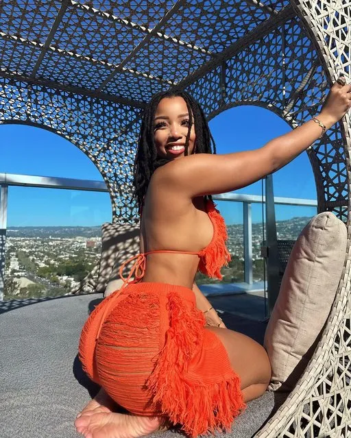 American singer-songwriter Chloe Bailey in the first decade of April 2024 shows off her assets in an orange bikini. (Photo by chloebailey/Instagram)