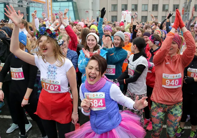 Participants of the “Beauty run” with a slogan “Women against violence” warm up before running on the main Nezavisimosti avenue in Minsk, Belarus, 08 March 2017. About 2000 participants took part in the event in connection with International Womens Day. (Photo by Tatyana Zenkovich/EPA)
