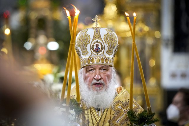 Russian Orthodox Patriarch Kirill delivers the Christmas Liturgy in the Christ the Saviour Cathedral in Moscow, Russia, Thursday, January 6, 2022. Parishioners wearing face masks to protect against coronavirus, observed social distancing guidelines as they attended the liturgy Orthodox Christians celebrate Christmas on Jan. 7, in accordance with the Julian calendar. (Photo by Alexander Zemlianichenko/AP Photo)