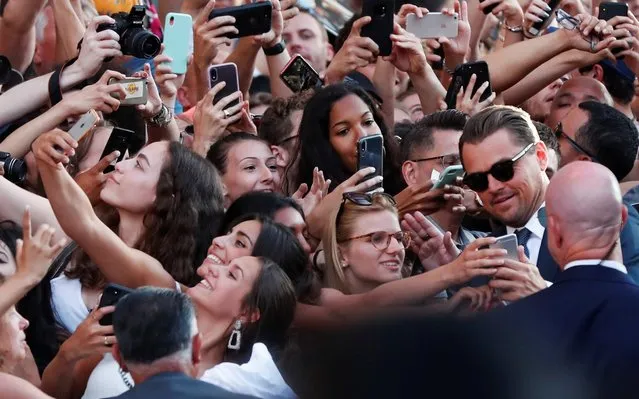 Leonardo DiCaprio takes pictures with fans at the premiere of Sony Pictures' “Once Upon a Time ... in Hollywood” in Los Angeles, California, U.S., July 22, 2019. (Photo by Mario Anzuoni/Reuters)