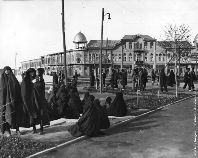 1950:  The central square of Hamadan where veiled women gather together