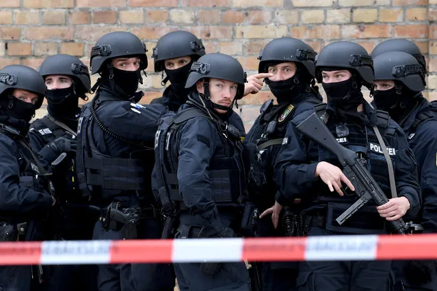 Police guard a crime scene near a Synagogue after a shooting in Halle, Germany, 09 October 2019. According to the police two people were killed in shootings in front of a Synagogue and a Kebab shop in the Paulus district of Halle in the East German federal state of Saxony-Anhalt. Police stated a suspect is already in arrest. Media report the mayor of Halle speaks of an amok situation. (Photo by Filip Singer/EPA/EFE)