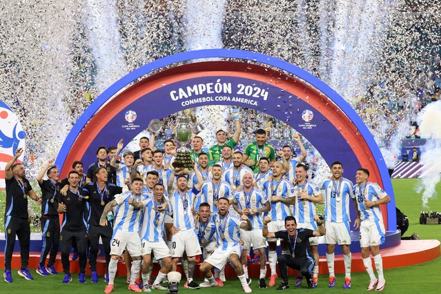 Argentina's forward #10 Lionel Messi lifts up the trophy as he celebrates winning the Conmebol 2024 Copa America tournament final football match between Argentina and Colombia at the Hard Rock Stadium, in Miami, Florida on July 14, 2024. (Photo by Charly Triballeau/AFP Photo)