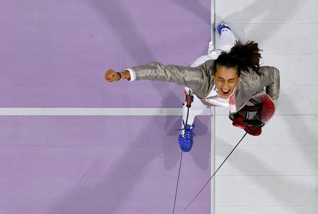 Sara Balzer of France celebrates winning her semifinal bout against Olga Kharlan of Ukraine during the women's sabre individual semifinals in Paris, France on July 29, 2024. (Photo by Albert Gea/Reuters)