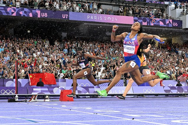 US' Sha'Carri Richardson crosses the finish line to win the women's 4x100m relay final of the athletics event at the Paris 2024 Olympic Games at Stade de France in Saint-Denis, north of Paris, on August 9, 2024. (Photo by Jewel Samad/AFP Photo)