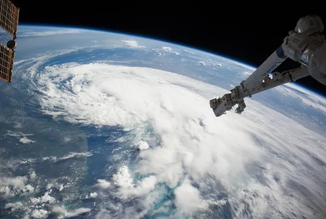 In this handout provided by NASA from the the Earth-orbiting International Space Station, weather system Arthur travels up the east coast of the United States in the Atlantic Ocean near Florida on July 2, 2014 in space. (Photo by NOAA via Getty Images)