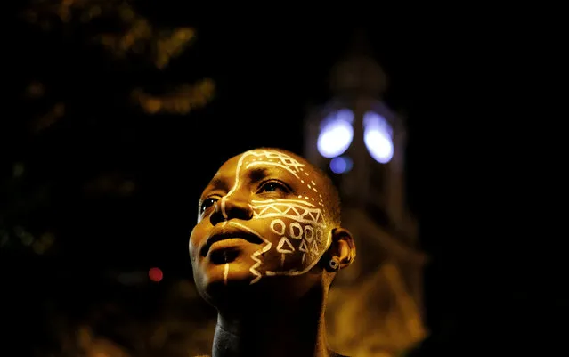 A demonstrator with face paint takes part in a protest by black and indigenous women against racism and machismo in Sao Paulo, Brazil, July 25, 2017. (Photo by Nacho Doce/Reuters)