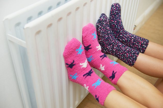 Snuggly and cosy in winter socks warming feet. (Photo by Peter Dazeley/Getty Images)