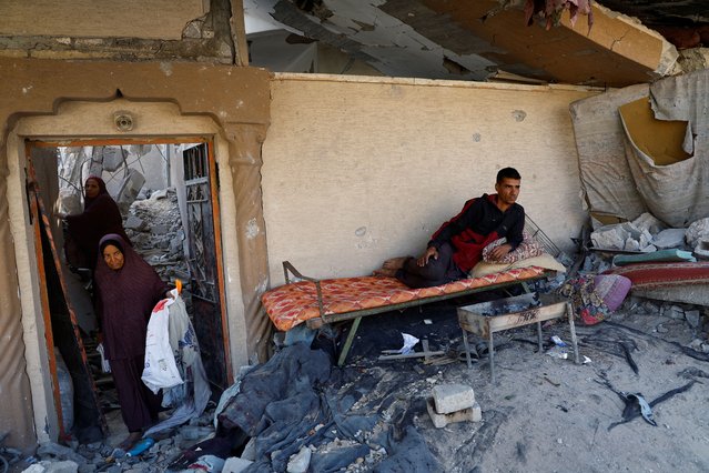 Palestinian man Sami Abu Nasser rests in front of the ruins of his house which was destroyed in the Israeli military offensive, amid the Israel-Hamas conflict, in Khan Younis in the southern Gaza Strip, on November 4, 2024. (Photo by Mohammed Salem/Reuters)