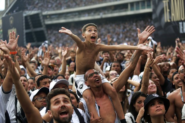 Brazil's Botafogo soccer fans react during the Copa Libertadores title match against Atletico Mineiro in Argentina, during a watch party at Nilton Santos Stadium, in Rio de Janeiro, Saturday, November 30, 2024. (Photo by Bruna Prado/AP Photo)