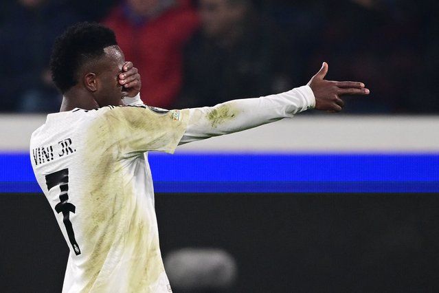 Real Madrid's Brazilian forward #07 Vinicius Junior celebrates scoring his team's second goal during the UEFA Champions League football match between Atalanta and Real Madrid at the Gewiss Stadium in Bergamo, on December 10, 2024. (Photo by Marco Bertorello/AFP Photo)