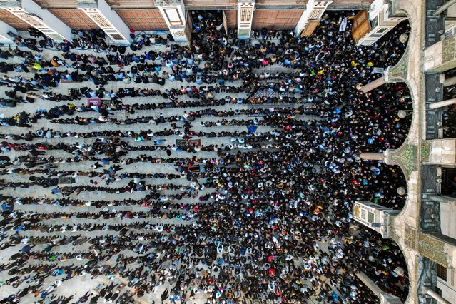 This aerial view shows Muslim worshippers attending the first weekly Friday prayers since the ouster of president Bashar al-Assad at the 8th-century Umayyad mosque in the old city of Damascus on December 13, 2024. Islamist-led rebels took Damascus in a lightning offensive on December 8, ousting president Bashar al-Assad and ending five decades of Baath rule in Syria. (Photo by Bakr Alkasem/AFP Photo)