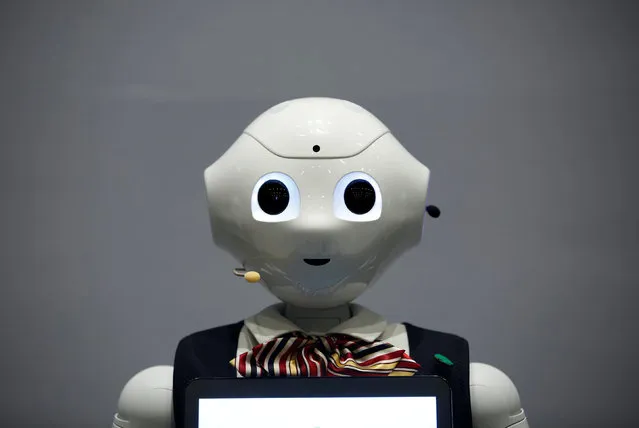 A SoftBank's robot “Pepper”, dressed in bank uniforms, is displayed during a news conference in Taipei, Taiwan July 25, 2016. (Photo by Tyrone Siu/Reuters)