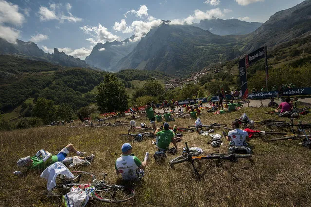 Fans of the Spain La Vuelta race take positions on the mountain to watch the 15th stage between Comillas and Sotres Cabrales, 175,8 kilometers (109 miles),  of the Spanish Vuelta cycling race that finish in Sotres Cabrales, northern Spain, Sunday, September 6, 2015.  Joaquin Rodriguez won the stage. (Photo by Alvaro Barrientos/AP Photo)