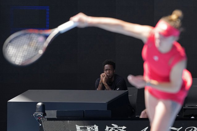 Gael Monfils watches his wife Elina Svitolina of Ukraine during her quarterfinal against Madison Keys of the U.S. at the Australian Open tennis championship in Melbourne, Australia, Wednesday, January 22, 2025. (Photo by Manish Swarup/AP Photo)