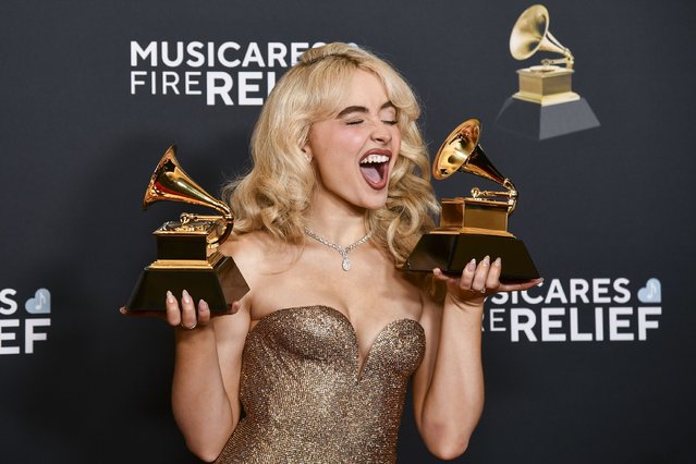 American singer Sabrina Carpenter poses in the press room with the award for best pop solo performance, and best pop vocal album during the 67th annual Grammy Awards on Sunday, February 2, 2025, in Los Angeles. (Photo by Richard Shotwell/Invision/AP Photo)