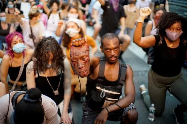 People kneel as they attend a protest against the death in Minneapolis police custody of George Floyd, in New York City, New York, U.S., June 4, 2020. (Photo by Eduardo Munoz/Reuters)