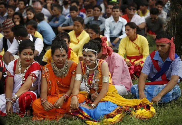 Performers dressed in traditional attire gathers during a celebration a day after the first democratic constitution was announced in Kathmandu, Nepal September 21, 2015. (Photo by Navesh Chitrakar/Reuters)