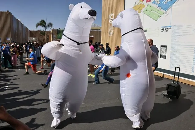Climate activists dressed as polar bears stage a protest outside the Sharm el-Sheikh International Convention Centre, in Egypt's Red Sea resort city of the same name, during the COP27 climate conference, on November 11, 2022. (Photo by Ahmad Gharabli/AFP Photo)