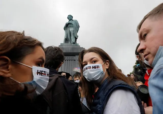 People gather near a monument to Russian poet Alexander Pushkin during a protest against amendments to Russia's Constitution and the results of a nationwide vote on constitutional reforms, in Moscow, Russia on July 15, 2020. The writings on face masks read: “No!”. (Photo by Shamil Zhumatov/Reuters)