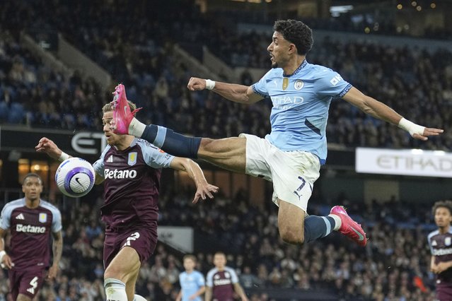 Manchester City's Omar Marmoush, right, in action against Aston Villa's Matty Cash during the English Premier League soccer match between Manchester City and Aston Villa at Etihad stadium in Manchester, England, Tuesday, April 22, 2025. (Photo by Jon Super/AP Photo)