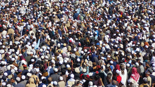People gather for the funeral of the victims in Bannu, Khyber Pakhtunkhwa (KPK) province, Pakistan, 05 March 2025. Suspected insurgents attacked an army base in Bannu district, northwestern Pakistan, killing at least 12 civilians and wounding many others on the evening of 04 March, according to police. Authorities stated that two suicide bombers detonated explosive-laden vehicles at the cantonment around 6:30 p.m., causing massive explosions that destroyed nearby houses and mosques. The Pakistani Taliban-affiliated group Jaish Al-Fursan claimed responsibility for the attack. (Photo by Abdullah Khan/EPA/EFE)