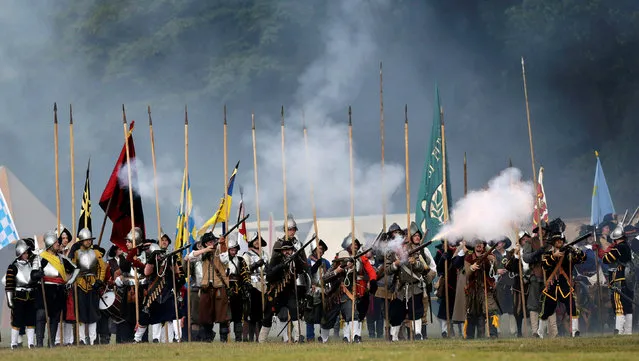 Participants wearing medieval costumes re-enact the 1620 battle of Bila Hora between Bohemian Estates and Austrian Imperial with Catholic forces in Prague, Czech Republic September 18, 2016. (Photo by David W. Cerny/Reuters)