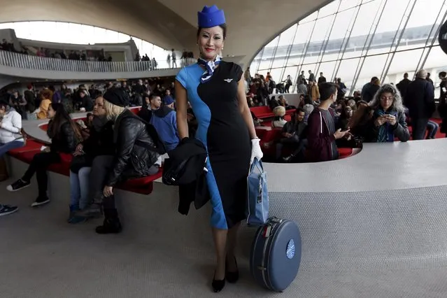 A woman poses inside the Trans World Airlines Flight Center at John F. Kennedy Airport in the Queens borough of New York, October 18, 2015. Thousands of visitors are expected at New York's John F. Kennedy Airport to get a last look at the iconic architecture of the Trans World Airlines Flight Center before the futuristic 1960s building is converted into a hotel. (Photo by Shannon Stapleton/Reuters)