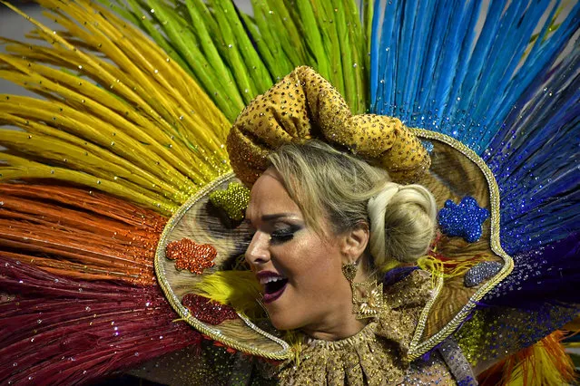 A reveller of the Tom Maior samba school performs during the first night of carnival in Sao Paulo, Brazil, at the city's Sambadrome early on February 10, 2018. (Photo by AFP Photo/Stringer)