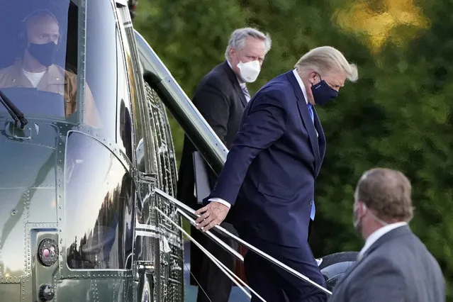 President Donald Trump arrives at Walter Reed National Military Medical Center, in Bethesda, Md., Friday, October 2, 2020, on Marine One helicopter after he tested positive for COVID-19. White House chief of staff Mark Meadows is at second from left. (Photo by Jacquelyn Martin/AP Photo)