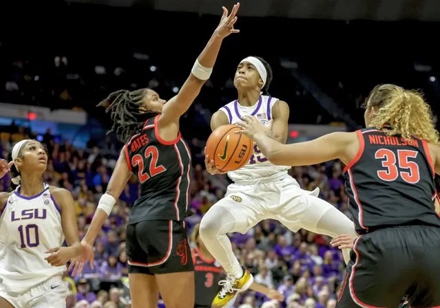 LSU guard Alexis Morris (45) drives between Georgia forwards Malury Bates (22) and Javyn Nicholson (35) in the first half of an NCAA college basketball game in Baton Rouge, La., Thursday, February 2, 2023. (Photo by Derick Hingle/AP Photo)