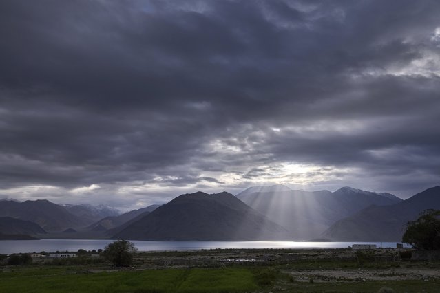 The sun rises over Pangong lake in Maan village, Ladakh, India, Tuesday, July 8, 2025. (Photo by Dar Yasin/AP Photo)