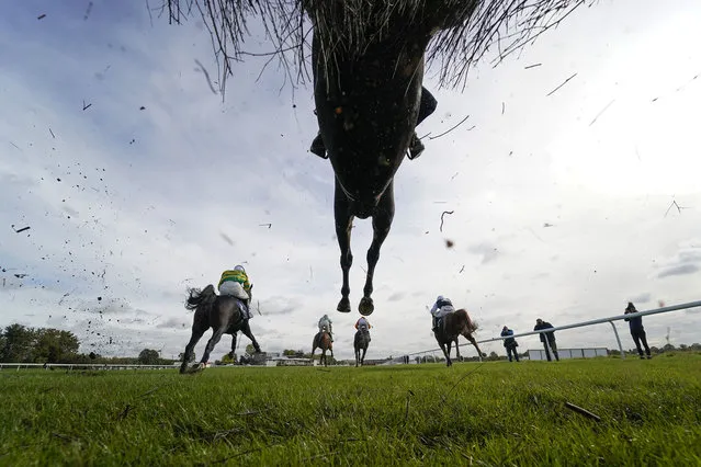A general view as runners clear a fence in The MansionBet Proud To Support British Racing Novices' Handicap Chase (GBB Race) (Div 2) at Huntingdon Racecourse on October 13, 2020 in Huntingdon, England. Owners are allowed to attend if they have a runner at the meeting otherwise racing remains behind closed doors to the public due to the Coronavirus pandemic. (Photo by Alan Crowhurst/Getty Images)