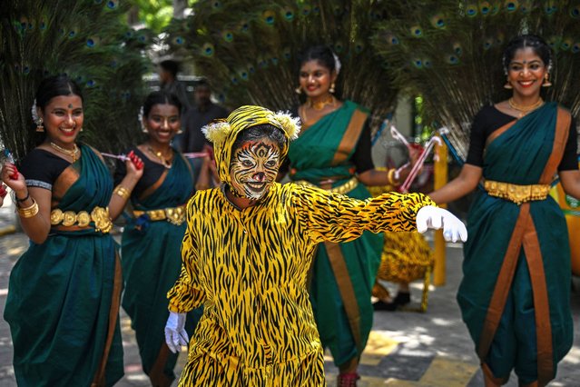An Indian student performs Puliyattam, a traditional folk dance, as part of the “Aadi Perukku” festival celebrations at a college in Chennai on August 1, 2025. (Photo by R.Satish Babu/AFP Photo)