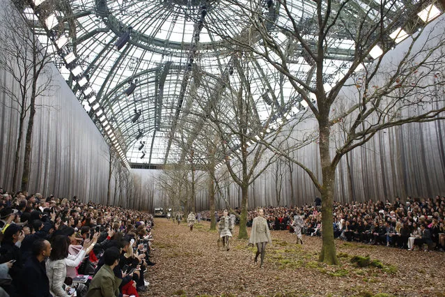 Models wear creations for the Chanel ready-to-wear fall/winter 2018/2019 fashion collection presented in Paris, Tuesday March 6, 2018. (Photo by Thibault Camus/AP Photo)