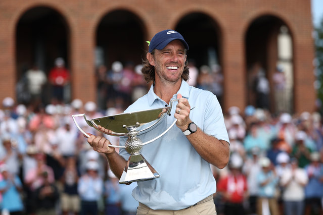 Tommy Fleetwood of England celebrates with the Fedex Cup trophy after winning the final round of the TOUR Championship 2025 at East Lake Golf Club on August 24, 2025 in Atlanta, Georgia. (Photo by Jared C. Tilton/Getty Images)