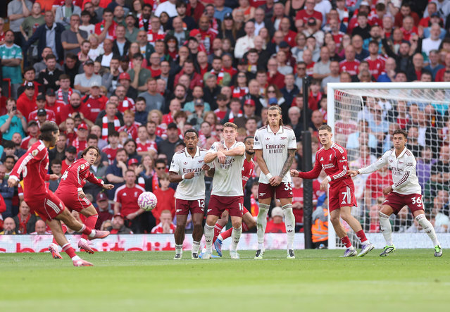 Dominik Szoboszlai of Liverpool scores his team's first goal in a free kick during the Premier League match between Liverpool and Arsenal at Anfield on August 31, 2025 in Liverpool, England. (Photo by Alex Pantling/Getty Images)