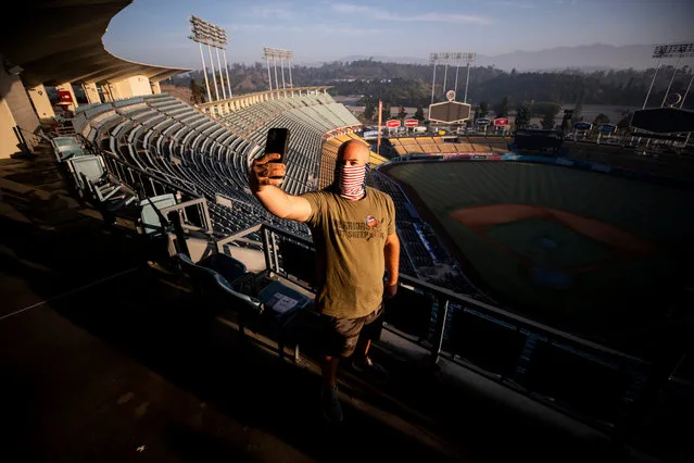 Chad takes a selfie over the stadium field after he casted his ballot at the Dodger Stadium polling location in Los Angeles, California, USA, 03 November 2020. Americans vote on Election Day to choose between re-electing Donald J. Trump or electing Joe Biden as the 46th President of the United States to serve from 2021 through 2024. (Photo by Etienne Laurent/EPA/EFE)