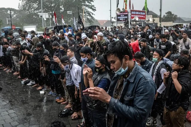 Indonesian Muslims pray as they gather condemn actions by French President Emmanuel Macron over his comments the Prophet Mohammed caricatures and calling for the boycott of French products on October 30, 2020 in Yogyakarta, Indonesia. (Photo by Ulet Ifansasti/Getty Images)