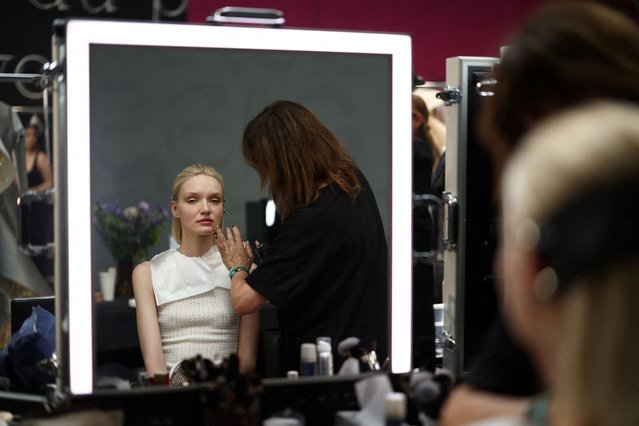 A model has her make up done backstage before the Rami Al Ali Haute Couture Fall/Winter 2025-2026 collection show in Paris, France, on July 10, 2025. (Photo by Tom Nicholson/Reuters)
