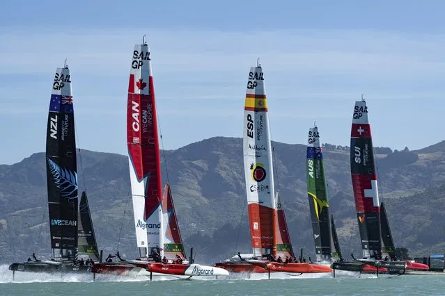 This handout photograph taken and released by SailGP on March 19, 2023 shows the SailGP F50 catamaran fleet in action on Race Day 2 of the ITM New Zealand Sail Grand Prix in Christchurch. (Photo by Bob Martin/SailGP via AFP Photo)